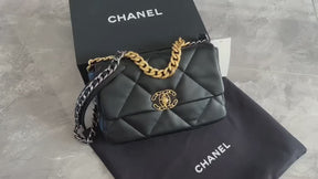 The classic Chanel 19 bag, featuring black and gold color scheme with a red interior, exudes both delicacy and grandeur, making it a must-have for every lady's collection.