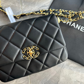 A small-sized women's bag in black and gold color, featuring classic diamond-shaped pattern, crafted from super soft lambskin leather, a must-have bag.